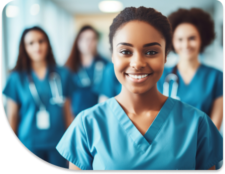 A group of health professionals are looking at the camera and smiling.