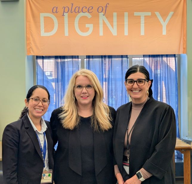 HRSA Administrator Carole Johnson poses with two staff members from the Boston Health Care for the Homeless Program.