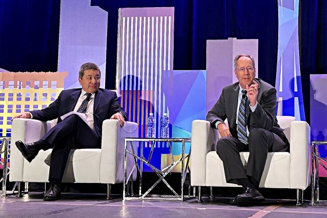 BPHC Associate Administrator Jim Macrae and another male seated on stage at 2024 National Association of Community Health Centers Partner Conference.