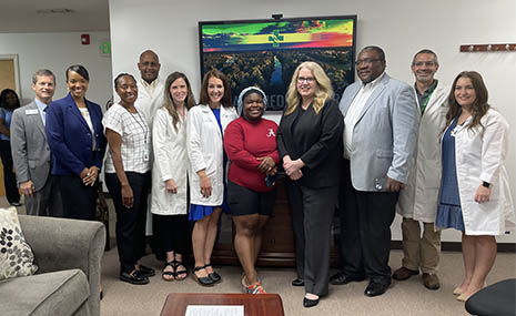 Group portrait of HRSA Administrator Carole Johnson and staff of the Cahaba Medical Care facility. 