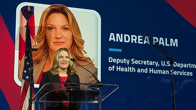 Andrea Palm, Deputy Secretary of the Department of Health and Human Services, stands behind a podium.