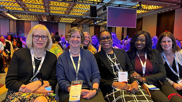 Group photo of HIV/AIDS Bureau Administrator, Dr. Laura Cheever, and four attendees to the 2024 National Ryan White Conference.