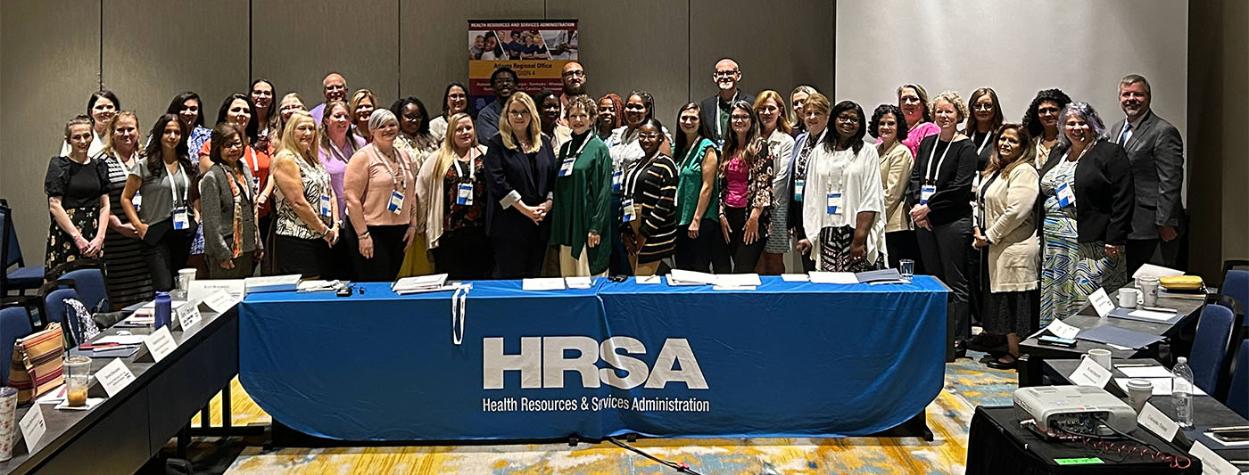 Group photo of HRSA Administrator Carole Johnson with over 40 other attendees gathered in a conference room for the Kentucky convening. 