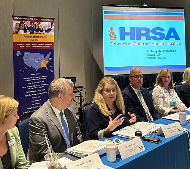 HRSA Administrator Carole Johnson and other HRSA leaders seated at a conference table.