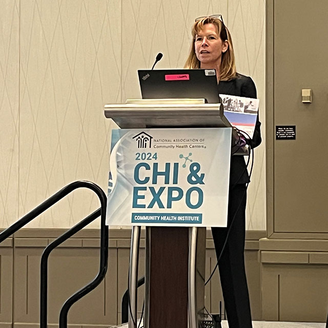 Tonya Bowers standing at a podium during the 2024 Community Health Institute & Expo.