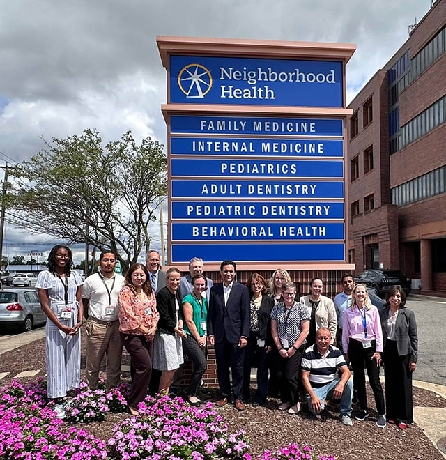 HRSA Administrator Carole Johnson, BPHC Associate Administrator Jim Macrae and staff from Neighborhood Health Center.