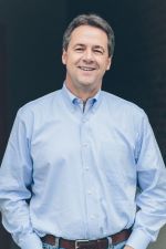 Governor Steve Bullock smiles at the camera.