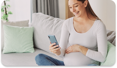 Pregnant woman looking at phone