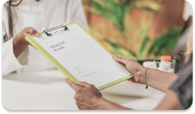 Person handing filled-out form to health professional