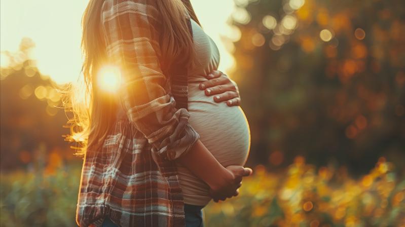 pregnant woman holding her stomach